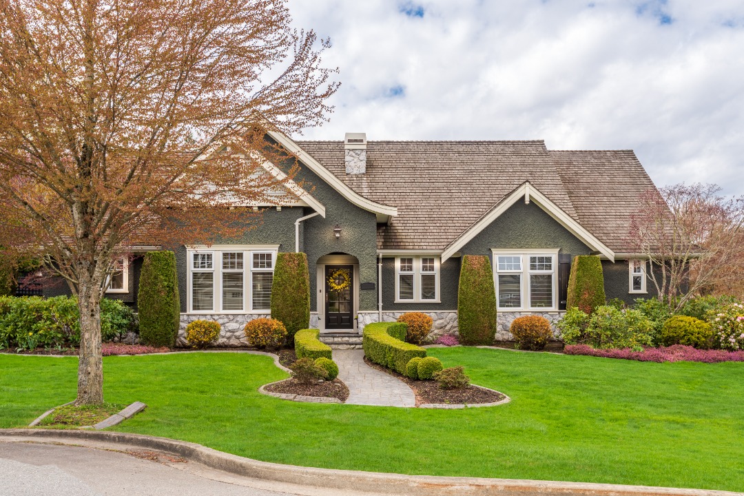 Modern home with sculpted shrubs and trimmed lawn offers the perfect backdrop for holiday christmas light installation ideas.